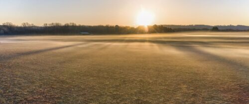 Beautiful foggy sunrise landscape in West Newton, Minnesota, USA, capturing autumn fields.