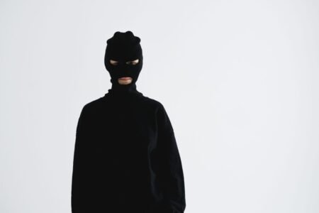 Portrait of an unrecognizable person in a balaclava, exuding a sense of mystery and anonymity.