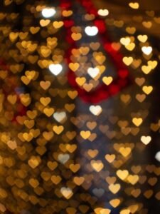Warm and romantic heart-shaped bokeh lights creating a festive atmosphere. Perfect for Valentine's Day themes.