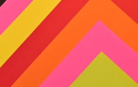 Vibrant abstract art featuring layered geometric shapes in bold colors.
