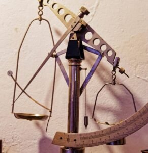 A large metal object sitting on top of a wooden table